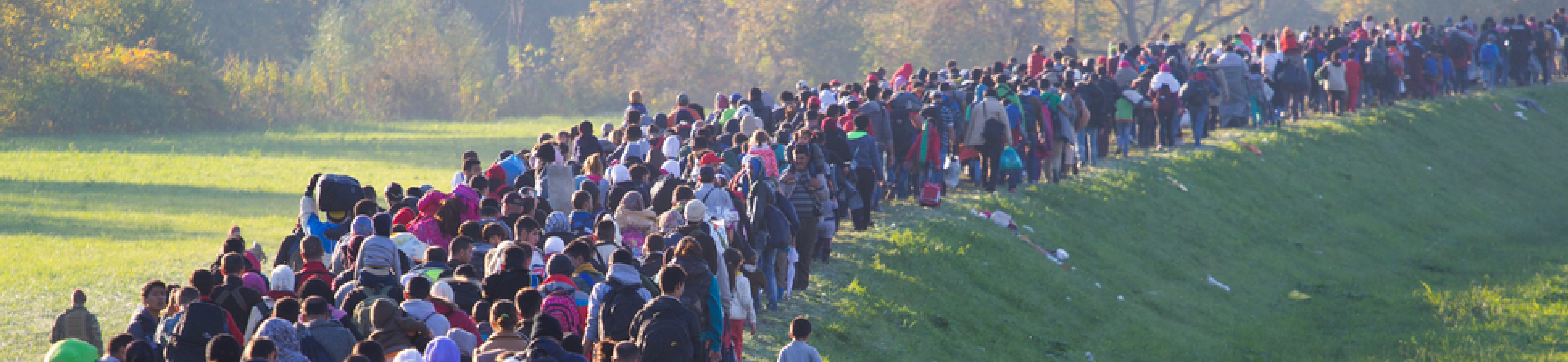 Immigrants walking to a refugee area